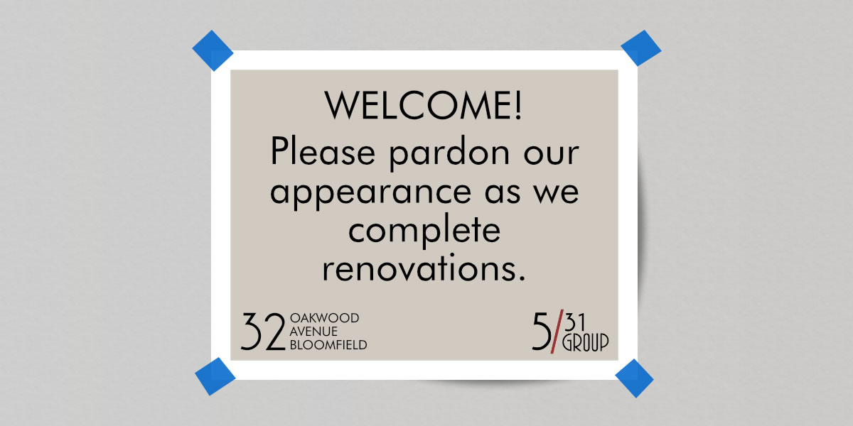 Sign: Please pardon our appearance as we complete renovations